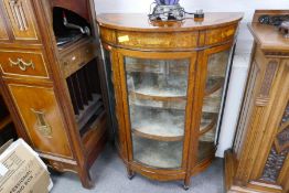 A reproduction Sheraton style bow fronted display cabinet having segmented top, 92cm