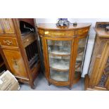 A reproduction Sheraton style bow fronted display cabinet having segmented top, 92cm