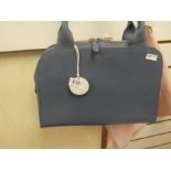 RADLEY; a blue leather handbag, complete with cloth outer cover