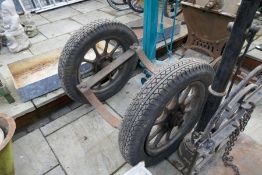 Pair of vintage wheels with pipe laying cradle