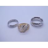 Three 9ct gold rings to include a two toned dress ring and two white gold wedding bands, all marked