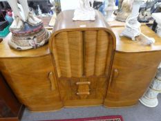 A 1930s Walnut sideboard having 2 central drawers by Marshall and Co 'Talent'