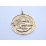 Chinese 18ct yellow gold circular pendant depicting a dragon and character marks 2.5cm diameter, mar