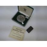 A 1985-1995 National Trust silver centenary medal, with the Certificate of Authenticity. Toned silve