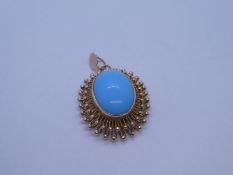 14ct yellow gold pendant with oval imitation turquoise in raised rubover setting and decorative 14K