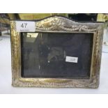 A pretty silver rectangular photoframe with bow decorated border, by BSC Ltd., navy velvet and easel