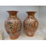 A pair of Japanese vases, decorated numerous figures, late 19th Century, 36.5cm (one damaged) marks