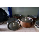 Six similar two handled copper pots with associated lids