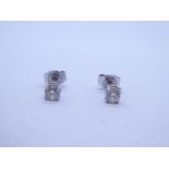 Pair of 18ct white gold diamond stud earrings, each approx 0.10 carat, marked 750