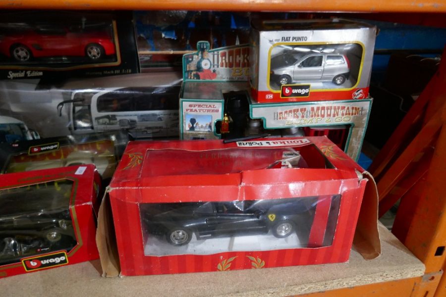 A quantity of 1:18 scale car models, mainly Burago, and other vehicles