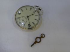A Victorian silver pocket watch and key in very good condition, winds and ticks. Hallmarked Birmingh