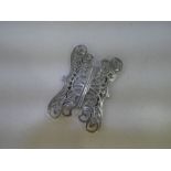 A decorative Victorian silver belt buckle of pierced pattern highlighting engraved Scroll design. Di