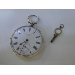 A vintage silver pocket watch and key in very good condition, winds and ticks. Marked Fine Silver, i