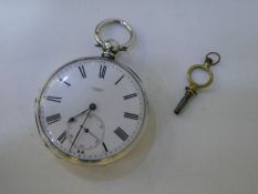 A vintage silver pocket watch and key in very good condition, winds and ticks. Marked Fine Silver, i