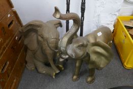 A large brass elephant and one other resin example