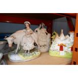 A Staffordshire figure of Lady with cow and two others