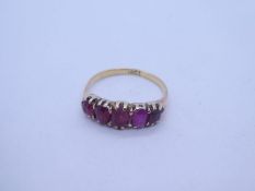 18ct yellow gold half hoop ring, set with 5 graduating rubies, marked 18ct, size L/M