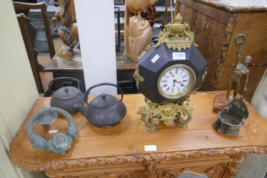 A French style clock with gilt metal mounts, a sculpture of man holding wreath and sundry