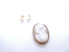 Pair of 9ct simulated pearl clip on earrings and a vintage cameo brooch