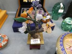 A modern oriental enamelled bowl on carved stand and an oriental miniature tree