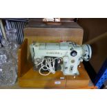 A Singer sewing machine, model 320K in hard canvas case