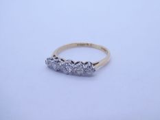 An early 20th Century 18ct and platinum 5 graduating diamond half hoop ring, approx 0.30cts total, c