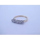 An early 20th Century 18ct and platinum 5 graduating diamond half hoop ring, approx 0.30cts total, c