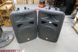 A pair of large JBL speakers with cables and stands model EON 15-G2