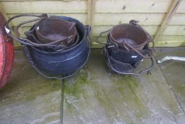 A quantity of cast iron pots with handles - all drilled for planting