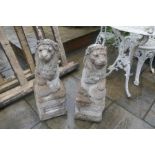 Pair reconstituted lions on plinths