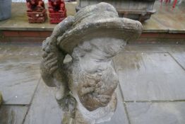 Reconstituted stone figure depicting cherub