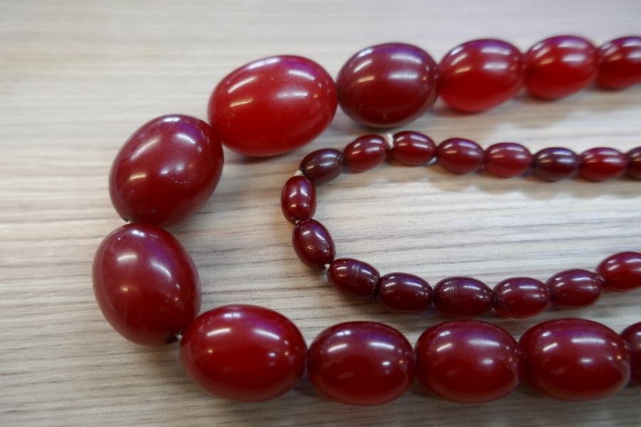 String of cherry red, possibly amber beads