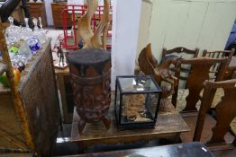 An oriental cork display in glazed case, an African drum carved figures and two other items