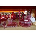 A quantity of old Cranberry glass items and similar