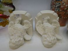 A pair of Parian wall brackets decorated Eagles