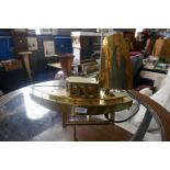 A brass table lamp in the form of a fishing boat