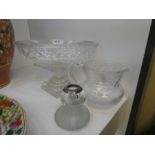 An old oval cut glass bowl on square foot, a vesta stand with silver collar and a brass jug