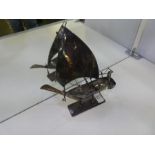 A model boat, silver however no marks seen. A very decorative piece with detailing, attachments on t