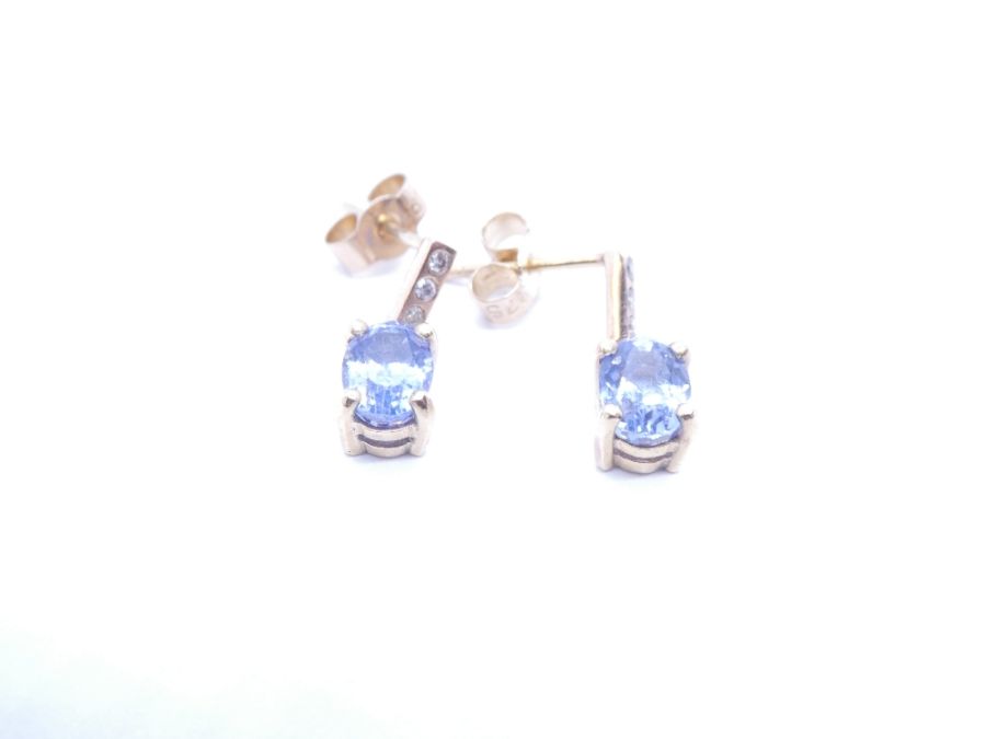 Pair of 18ct yellow gold sapphire and diamond earrings, each set 2 oval cut sapphires each approx 2.