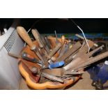 A bucket of tools, mainly files