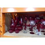 A quantity of red glass vases and similar