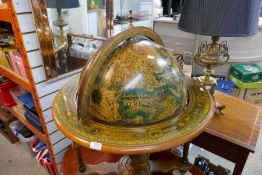 A reproduction drinks trolley in the form of a globe