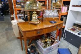 A reproduction bow fronted side table and a reproduction oval coffee table