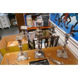 A silver plated candelabra, a matching pair of candlesticks and sundry