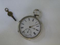A Victorian silver pocket watch and key in very good condition, winds and ticks. Hallmarked Chester