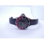 TAG HEUER; A Etanche Acier 20ATM Tag Heuer wristwatch, with black dial and cream dot markers, date a