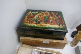 A large Russian style lacquer box, the lid decorated figures and horses