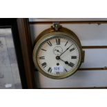 A small brass ships bulkhead clock