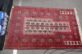 An Afghan prayer rug with geometric style design, 146 x 93 cms