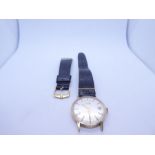 9ct gold cased Uno wristwatch with champagne dial, baton markers, date aperture on black leather str